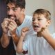 Father and son flossing together