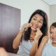 mother showing child that dental hygiene can be fun